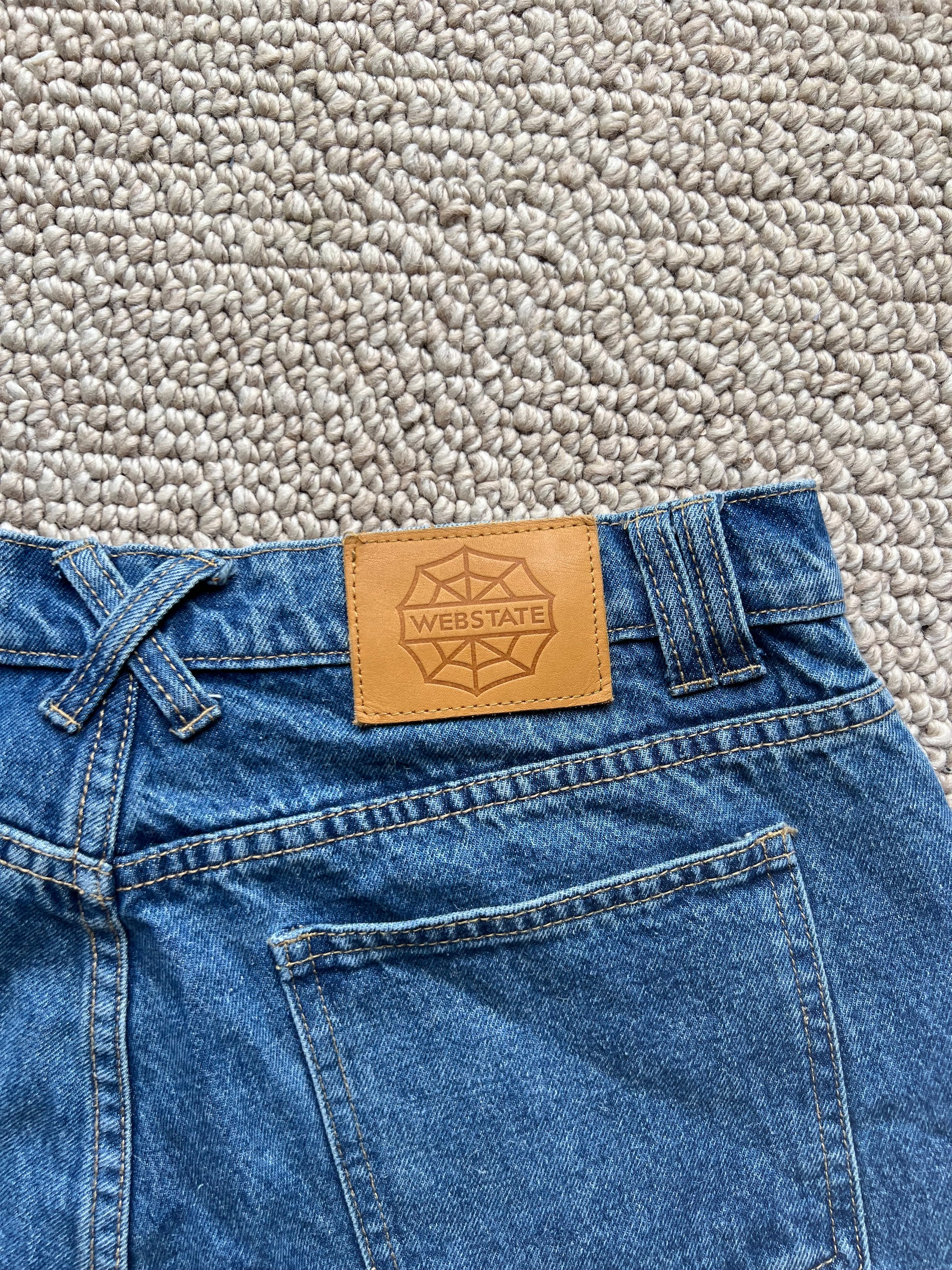 Webstate blue double knee jorts on skater - functional reinforced skate jorts