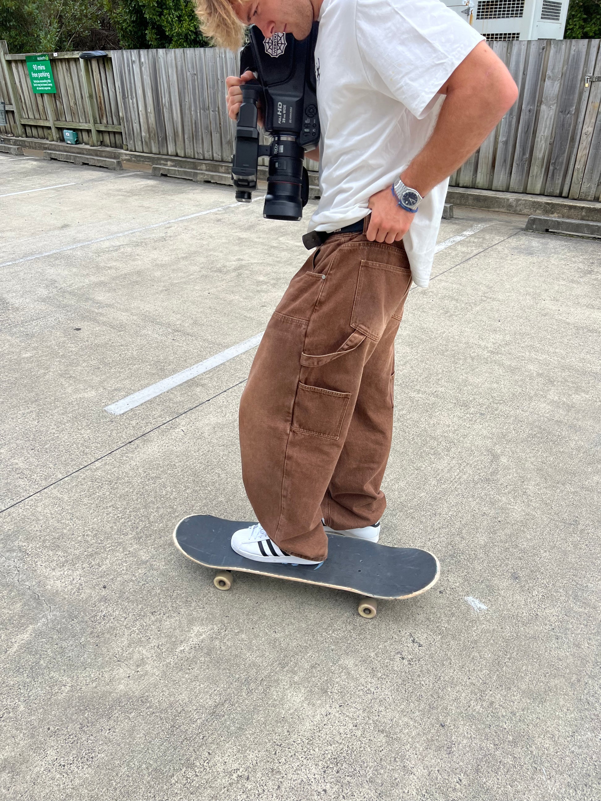 Webstate double knee brown jeans close-up - stitching reinforced skate denim